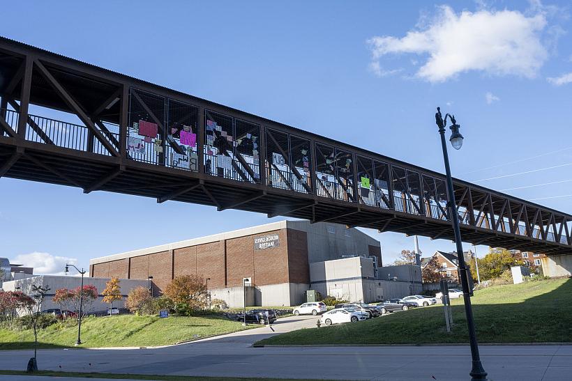 After the college's Black Lives Matter signs were removed, students added their own signs to the Powerhouse Bridge.